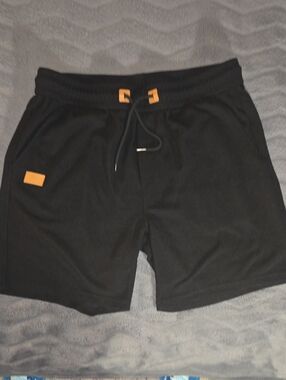 Men's Black Athletic Shorts with Orange Accents - Drawstring Performance